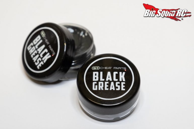 Two containers of Cheat Parts Black Grease